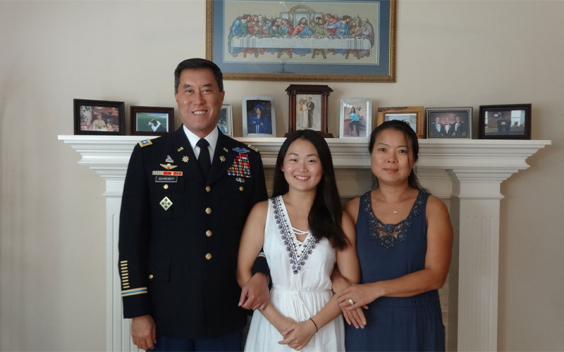 Lt. Col. Patrick Schreiber and Soo Jin Schreiber brought their niece Hyebin, center, to the U.S. from South Korea when she was 15, and adopted her at 17. Federal officials argue she's not eligible for citizenship. Photo: Sharma-Crawford Attorneys at Law